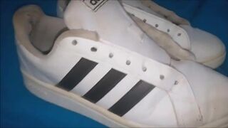"A pair of white Adidas sneakers worn by a beautiful preppy girl." - 15 image