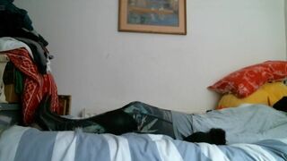 Italian designer boots and grey outfit on the bed