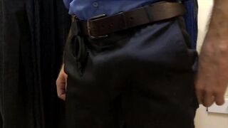 The guard checks the guy and jerks off the store