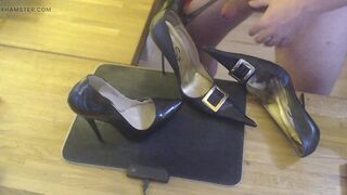 A guy masturbates with a high heel and cums on two pairs high heels