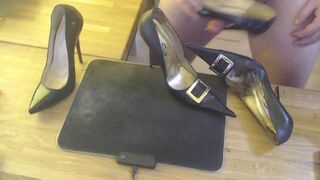 A guy masturbates with a high heel and cums on two pairs high heels