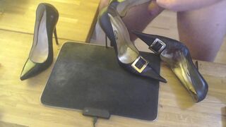 A guy masturbates with a high heel and cums on two pairs high heels