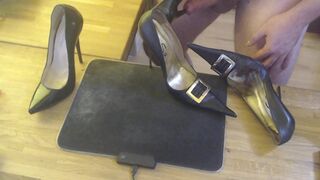 A guy masturbates with a high heel and cums on two pairs high heels