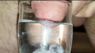 Extreme Closeup Huge Thick Load of Cum Edged Out Into Cup of whather - 1 image