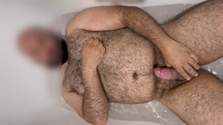 Extended: Uncut hung bear getting hard in the bathtub with slow motion cumshot