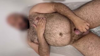 Extended: Uncut hung bear getting hard in the bathtub with slow motion cumshot
