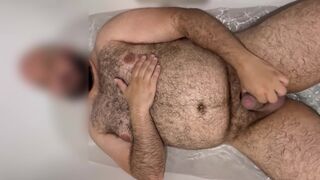 Extended: Uncut hung bear getting hard in the bathtub with slow motion cumshot