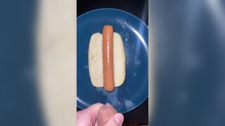 Huge watery cumshot on hotdog