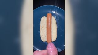 Huge watery cumshot on hotdog