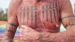 Playing with my nipples at the beach