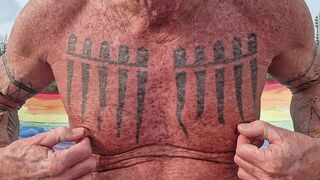 Playing with my nipples at the beach