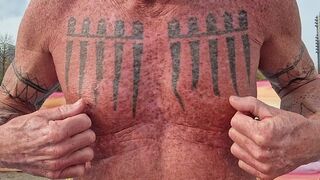 Playing with my nipples at the beach