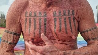 Playing with my nipples at the beach