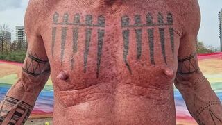 Playing with my nipples at the beach