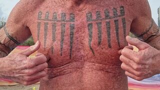 Playing with my nipples at the beach