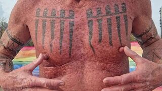 Playing with my nipples at the beach