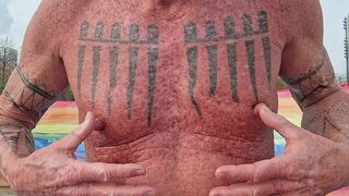 Playing with my nipples at the beach