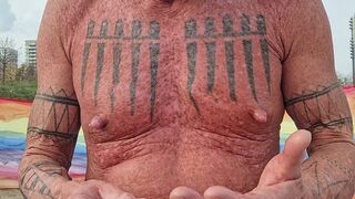 Playing with my nipples at the beach