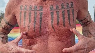 Playing with my nipples at the beach