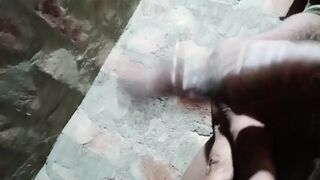 Gay guy spanking his cock in the bathroom