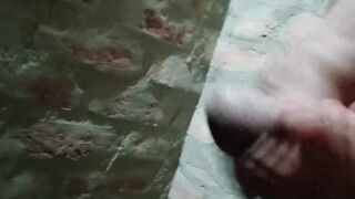 Gay guy spanking his cock in the bathroom