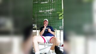 Coach after practice enjoying a cigarvand getting off - 1 image
