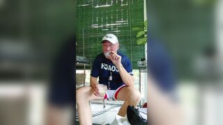 Coach after practice enjoying a cigarvand getting off - 2 image