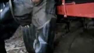 great guy in waders, rubber boots, mud and overall