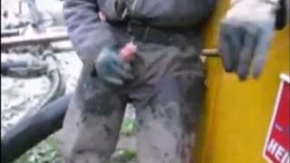 great guy in waders, rubber boots, mud and overall