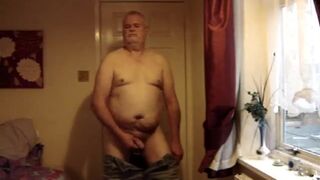 Mature man strips and jerks off.