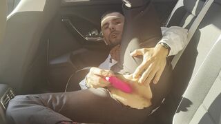 Kinky gentleman slave spread legs and plays with his ass in a car in public