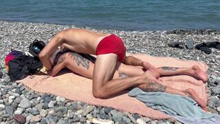 Falcon Al's oiled up ass takes a hard pounding on the beach before being rimmed and filled with cum