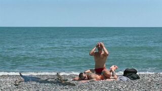 Falcon Al's oiled up ass takes a hard pounding on the beach before being rimmed and filled with cum