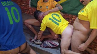 Watch as these Brazilian amateurs dominate their colleague's huge black cock during a soccer game!