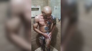 Watch Dadboy18mais tease her body in the shower, flaunting her tattooed body! - 1 image