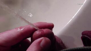 Watch me take a close-up view of my peehole while I pee in slow motion