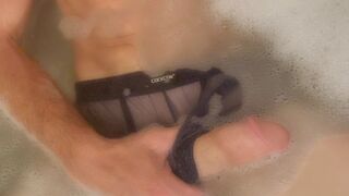 Male Masturbation Video in His Mesh Shorts. Watch him Rub Massage Oil on his Thick Heavy Cock until hes Rock Hard - 1 image