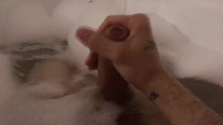 The guy jerks off taking a bath with foam - 11 image