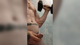 Flexing muscles with dumbbells while masturbating and shooting piss fountain. Short quick cum. - 8 image