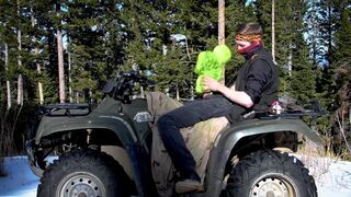 Biker fucks plush toy while on ATV four wheeler in the wilderness.