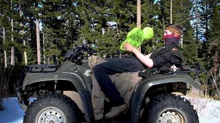 Biker fucks plush toy while on ATV four wheeler in the wilderness.