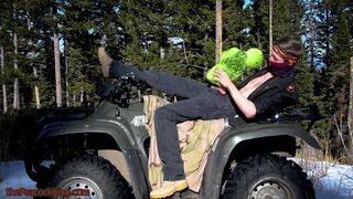 Biker fucks plush toy while on ATV four wheeler in the wilderness.
