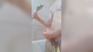 Jerking off in bathtub - using showerhead to stimulate dick - 2 image